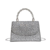 Trapezoid Shape Flap Twist Handle Single Side Diamante Bag